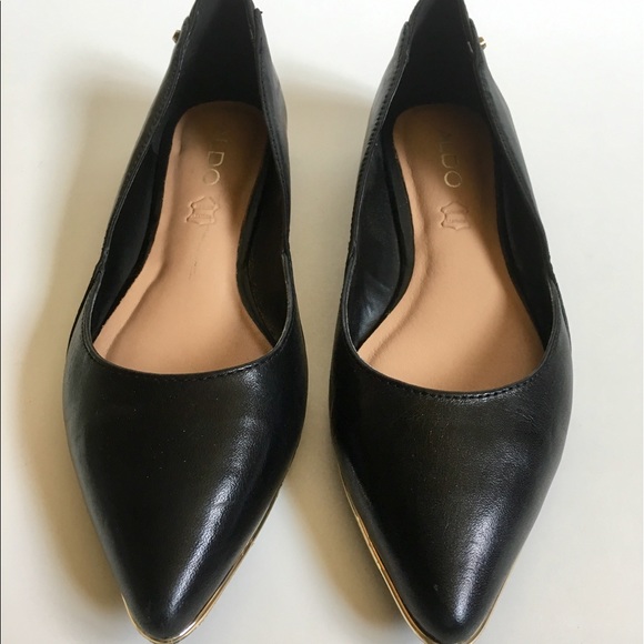 black flats with gold trim